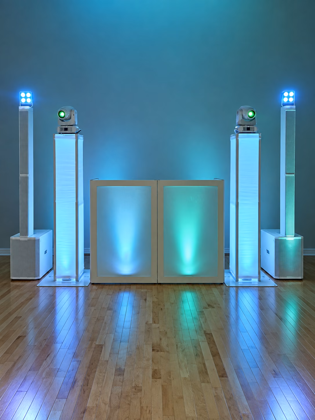 The Royal Crown booth, column speakers, and moving-head lights in teal